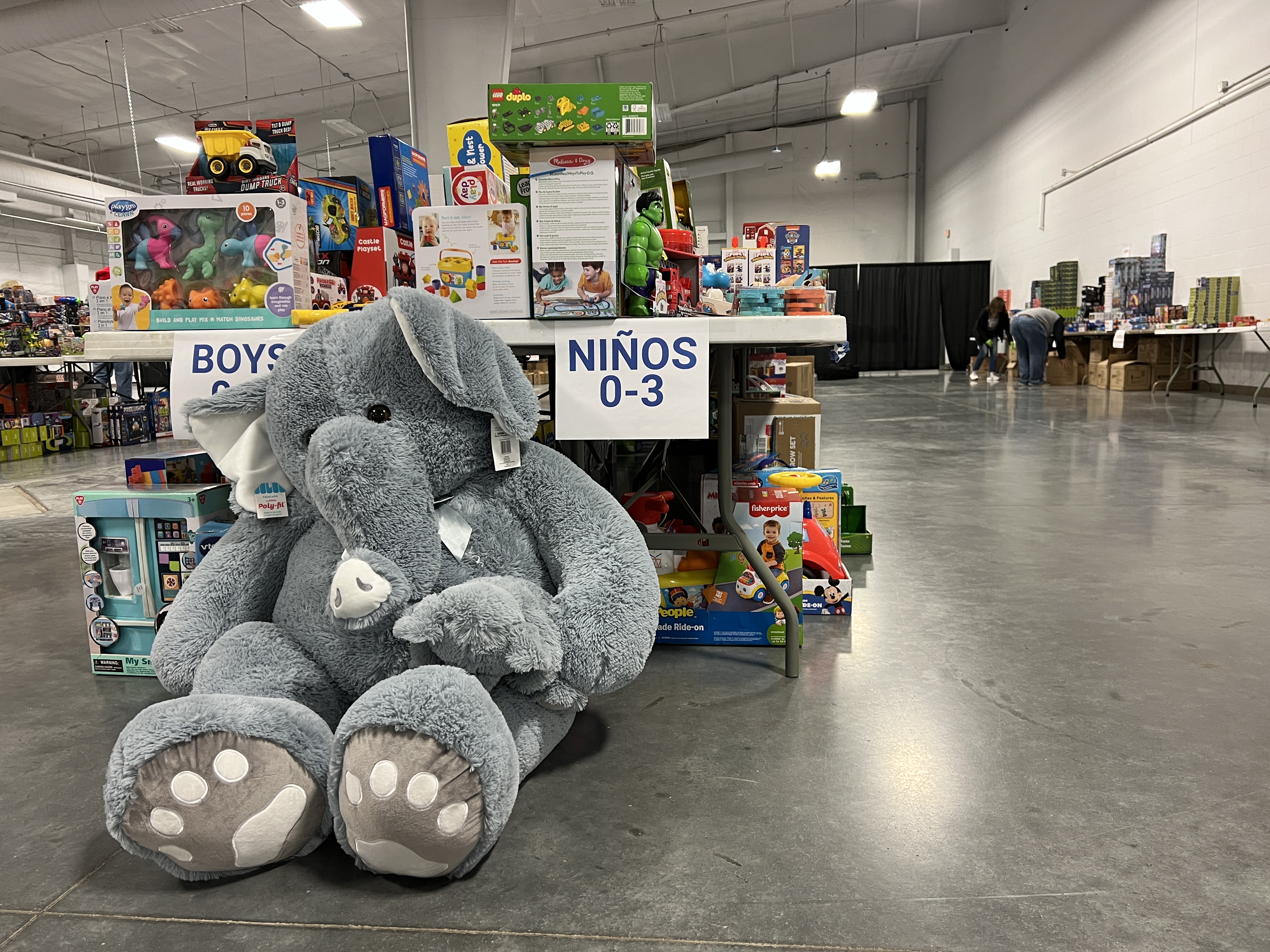 A giant elephant stuffed animal sits among other toys during the 2024 Heartland United Way Holiday Toy Drive.