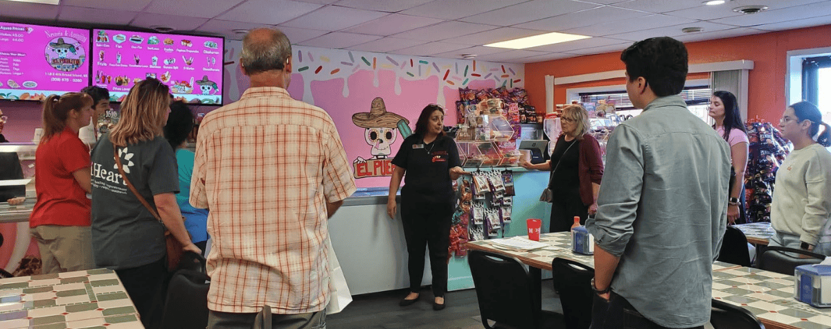 4th Street Business Tour stops at El Pueblito in 2024.