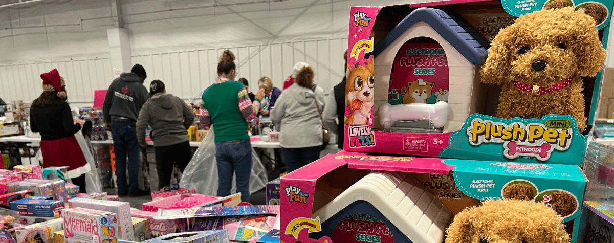 Parents pick from piles of toys during the 2024 Heartland United Way Toy Drive.
