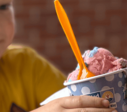 Elijah Wachter of Ravenna receives Scoops ice cream.