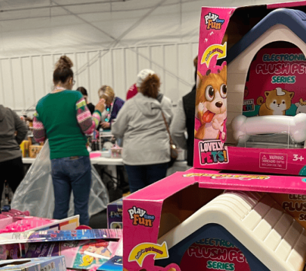 Parents pick from piles of toys during the 2024 Heartland United Way Toy Drive.