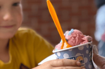 Elijah Wachter of Ravenna receives Scoops ice cream.