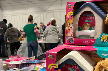 Parents pick from piles of toys during the 2024 Heartland United Way Toy Drive.