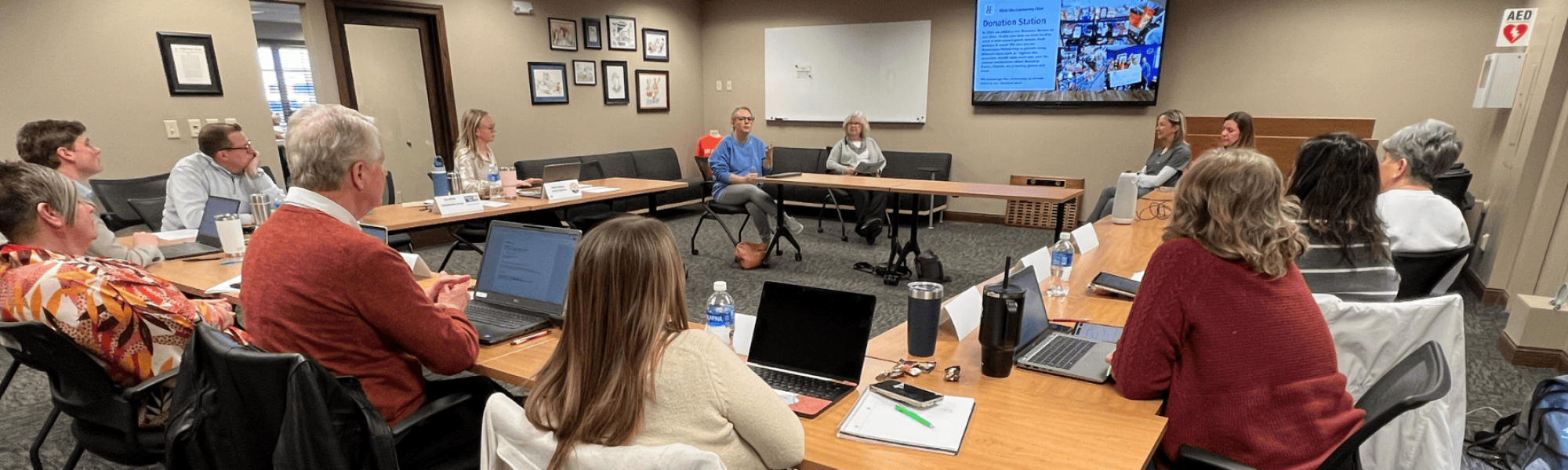 Volunteers gather in the Heartland United Way conference room for Community Investment.