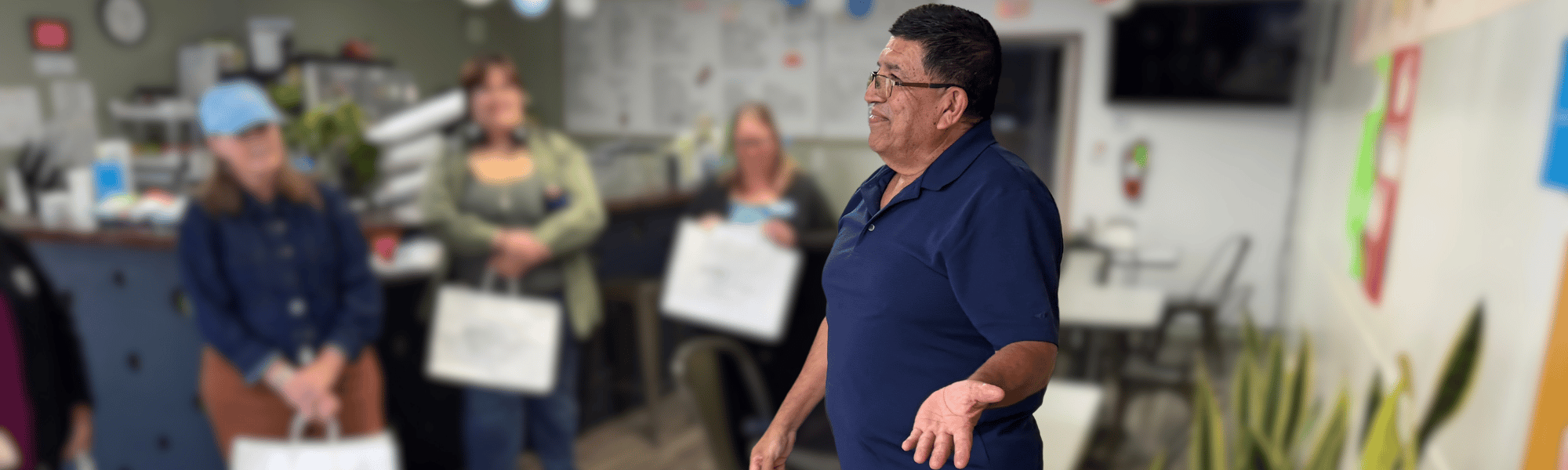 Club Mundo owner talks to participants of the Welcome In: Community Business Tours 2026.