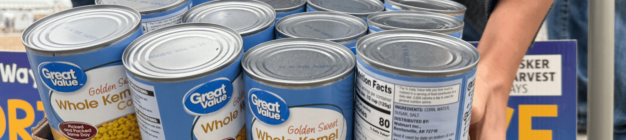 Financial Stability - An FFA member donates canned food.
