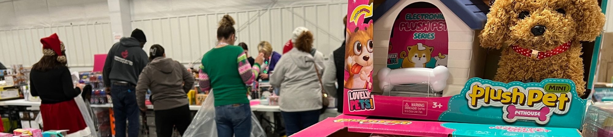 Participants pick out toys during the 2024 Holiday Toy Drive
