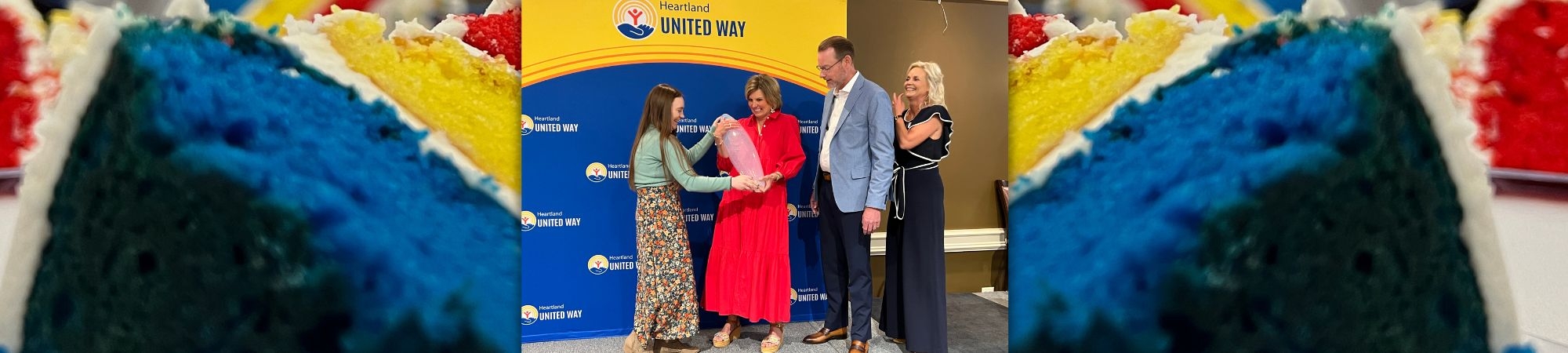 Karly Behrendt presents a gift to Campaign Chairs Andy and Erin Marsh