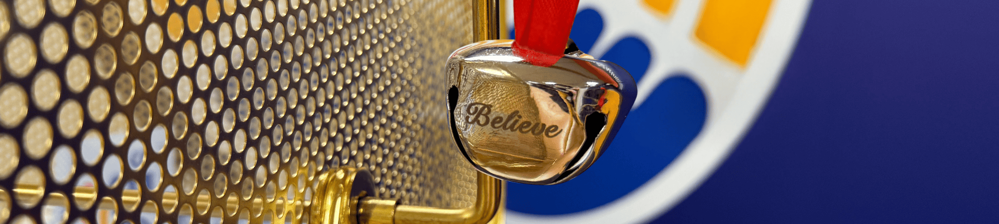 Silver bell hangs on a raffle drum