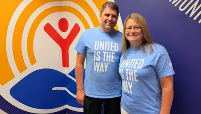 Dave and Rachel Richardson in front of the United Way circle of hope.