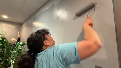 Staff from the Stuhr Museum Foundation paint at Hope Harbor during Day of Action 2026.