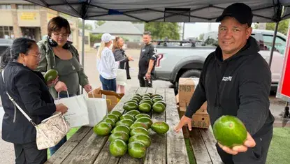 Large avocados are passed out at El Valle Food Truck during Welcome In: Community Business Tours 2026.
