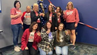 The Go Big GIVE team celebrates a record fundraising event