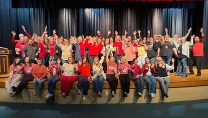 Nonprofit participants of Go Big GIVE 2026 pose for a photo in red shirts.