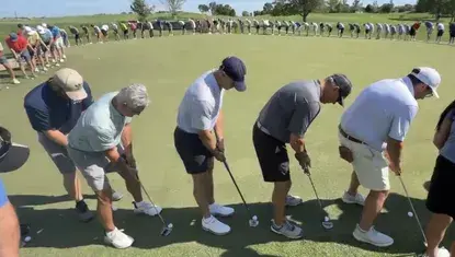 Participants of the 39th Annual Heartland United Way Golf Tournament join together for a putt.