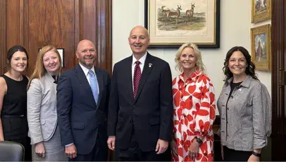 Heartland United Way President Karen Rathke and other Nebraska United Way leaders stand with Senator Pete Ricketts during 2025 United Way Hill Day.