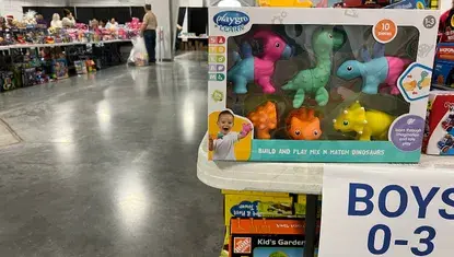 Toys are stacked on tables as people in need shop during the Heartland United Way and Toys for Tots Distribution in 2024.
